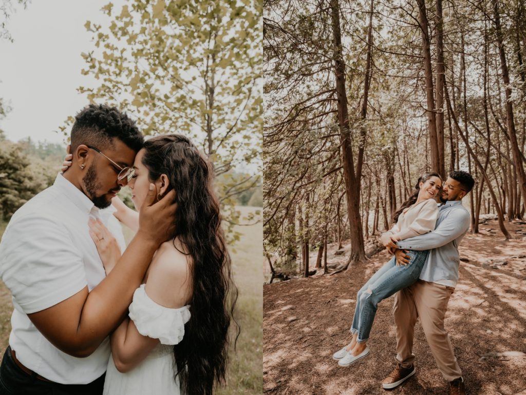 Man picks up woman and twirls her in a forested area for a fun engagement photo. They are looking at each other and smiling. Captured by London, Ontario wedding and engagement photographer Ashlee Ellison.